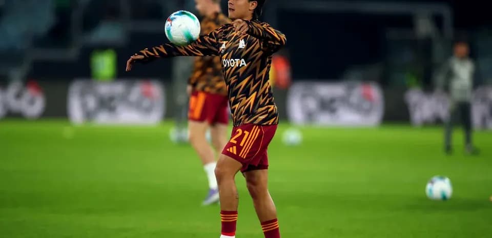 Player warming up and juggling ball during training