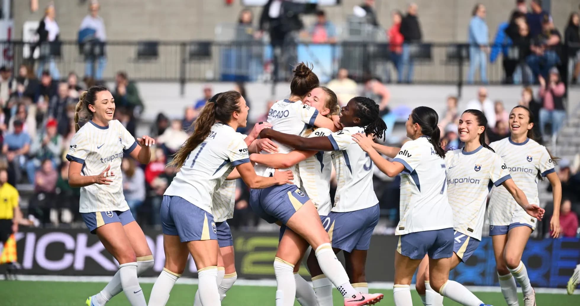 Players celebrating a goal during the match