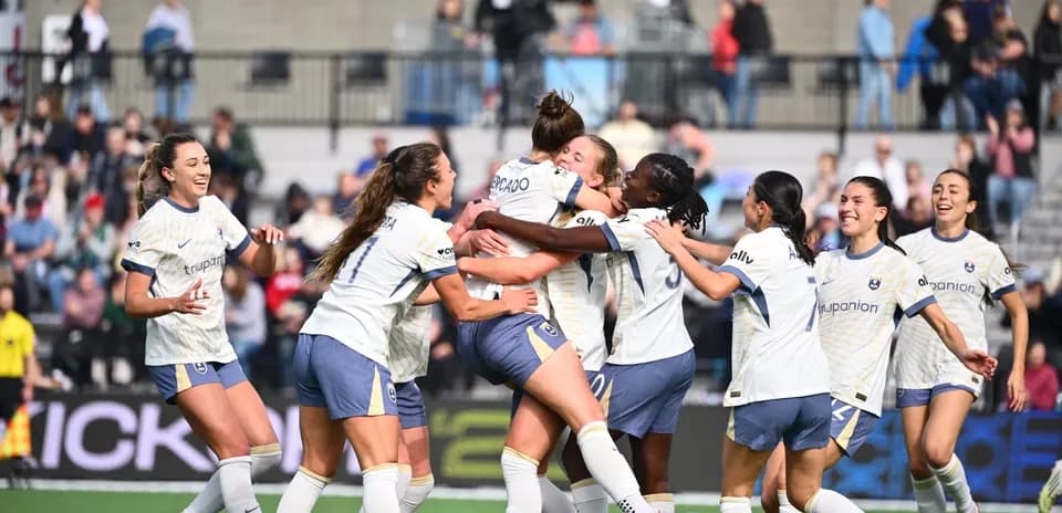 Players celebrating a goal during the match