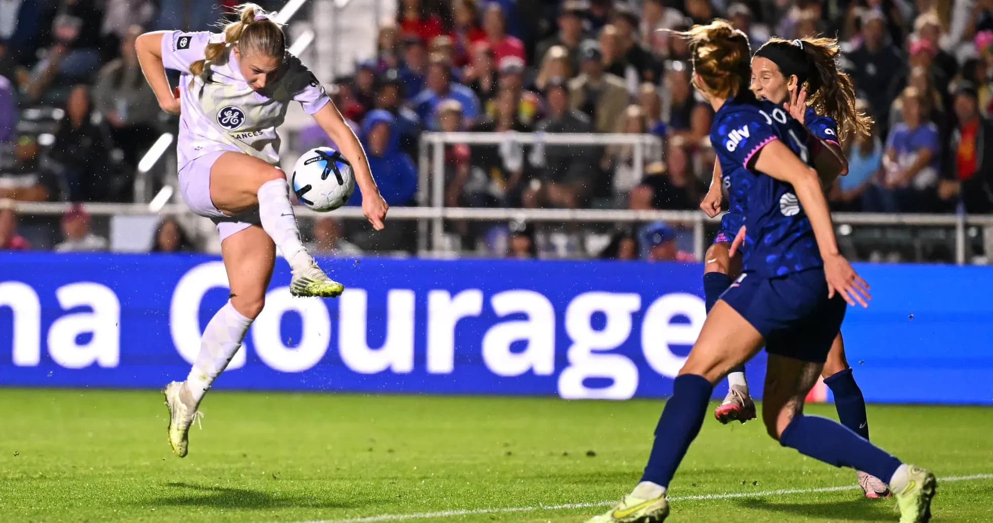 Player kicking ball during Racing Louisville vs North Carolina