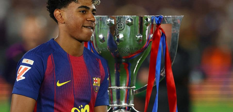 Player celebrating with trophy after winning match