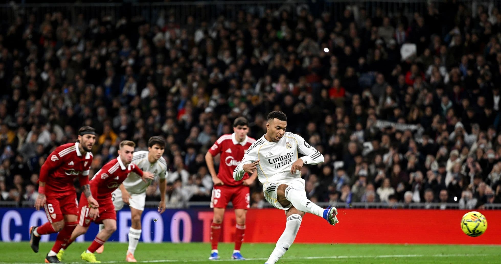 Player taking a penalty kick during match