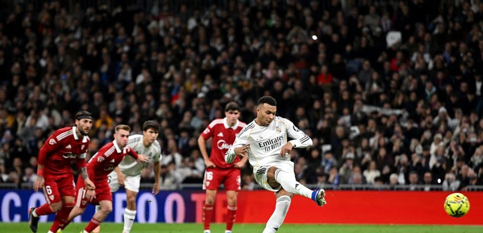 Player taking a penalty kick during match