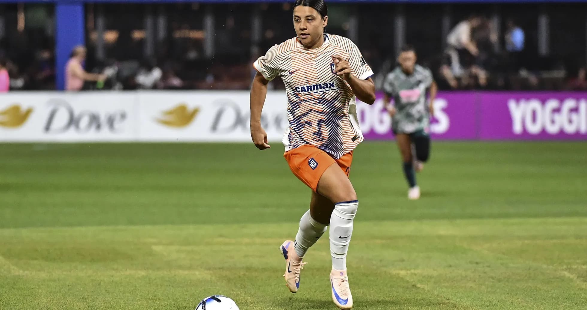 Player dribbling the ball during a soccer match