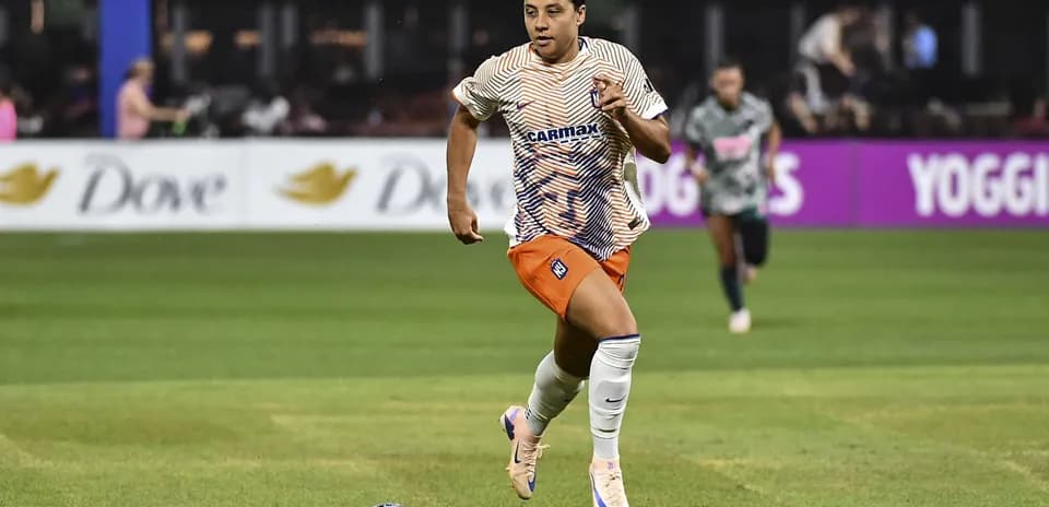 Player dribbling the ball during a soccer match