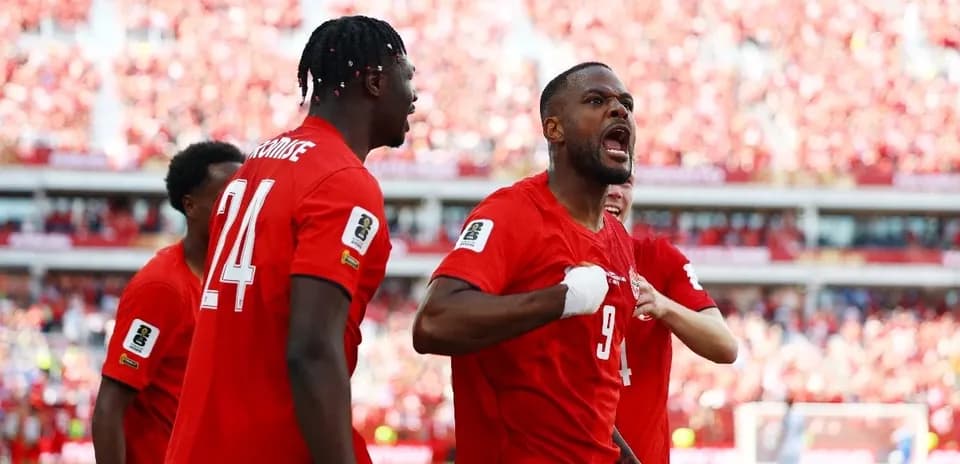 Canada players celebrating a goal during match