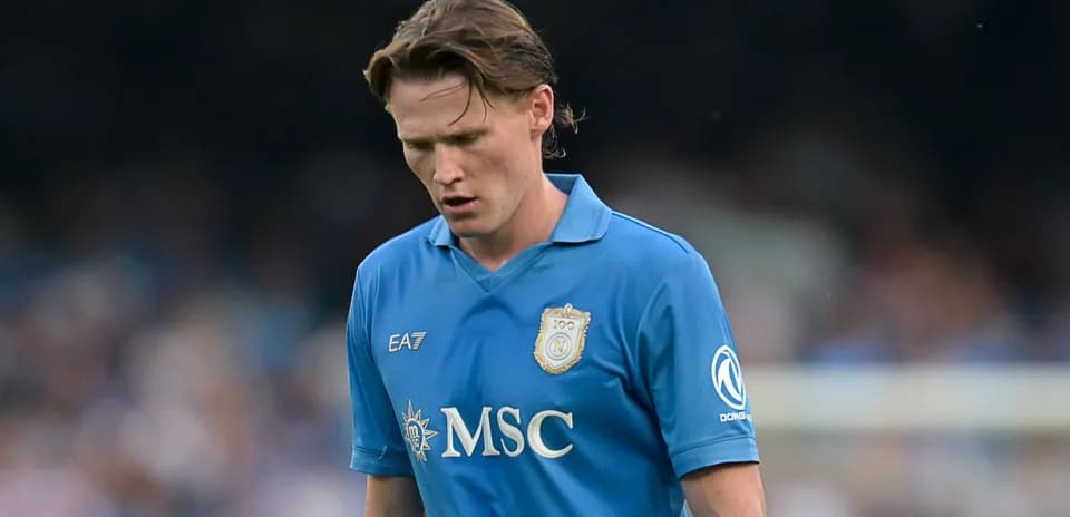Player in blue jersey walking during match