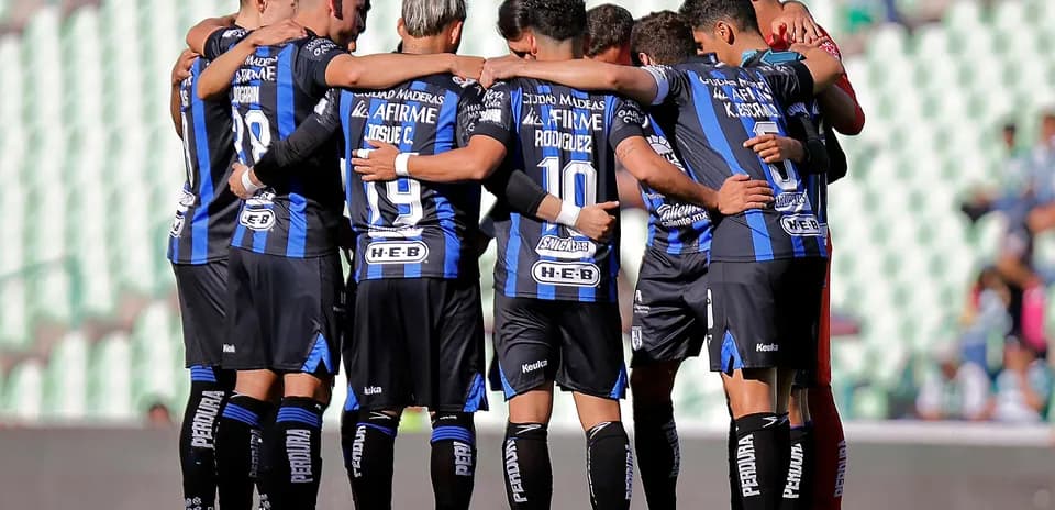 Club Queretaro players huddling before the match