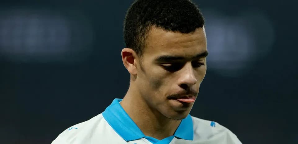 Player looking down, wearing team jersey