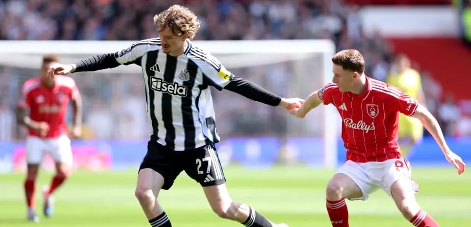 Newcastle player in action against Nottingham Forest