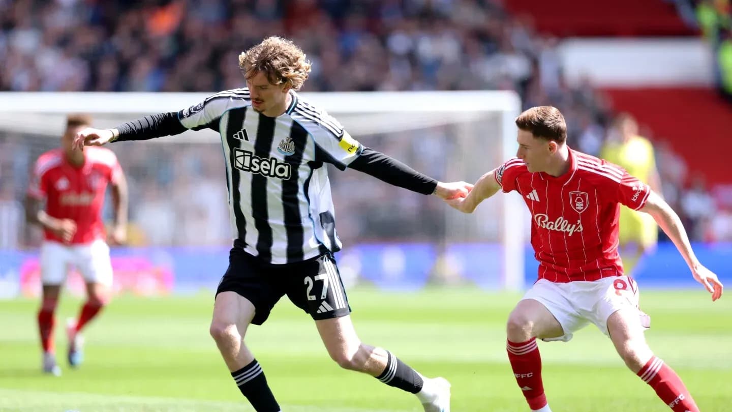 Newcastle player in action against Nottingham Forest