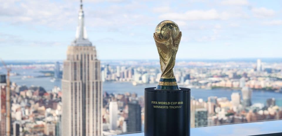 FIFA World Cup trophy with skyline backdrop