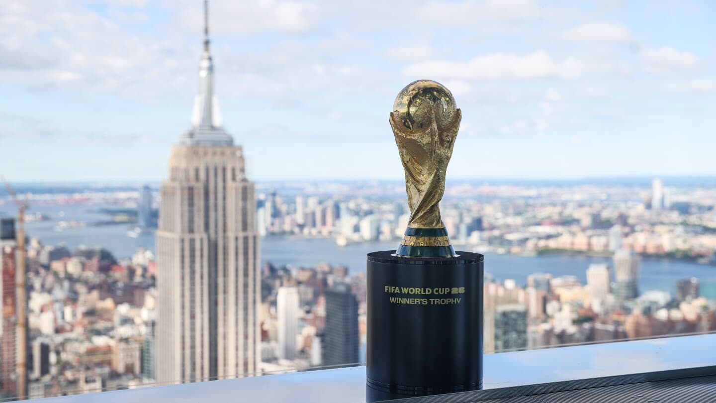 FIFA World Cup trophy with skyline backdrop