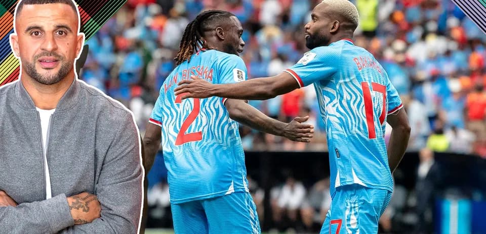 Two players celebrating a goal on the field