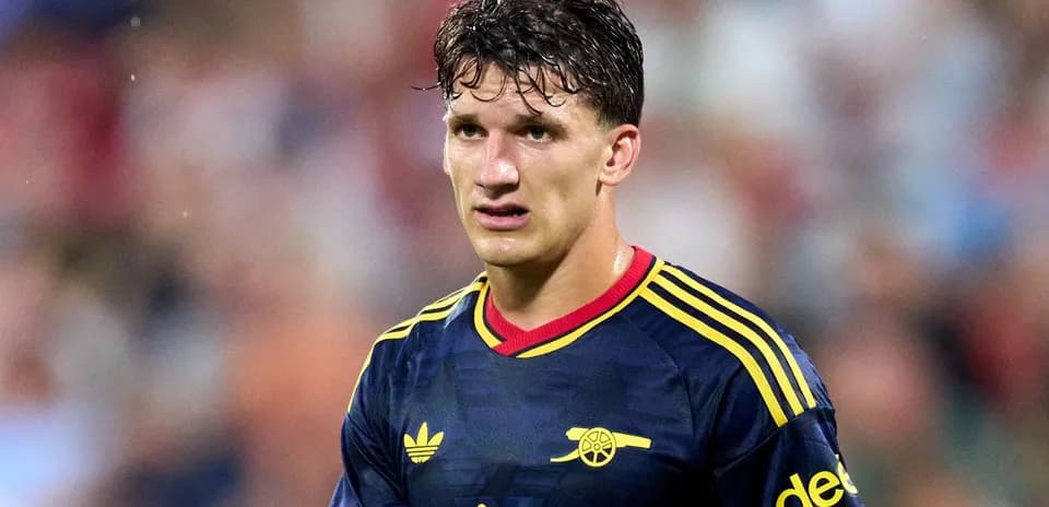 Player wearing Arsenal jersey on the field
