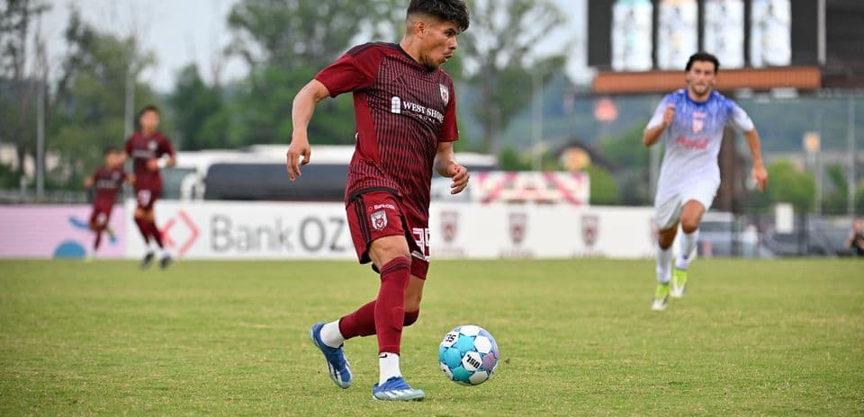 Player dribbling the ball during One Knoxville match