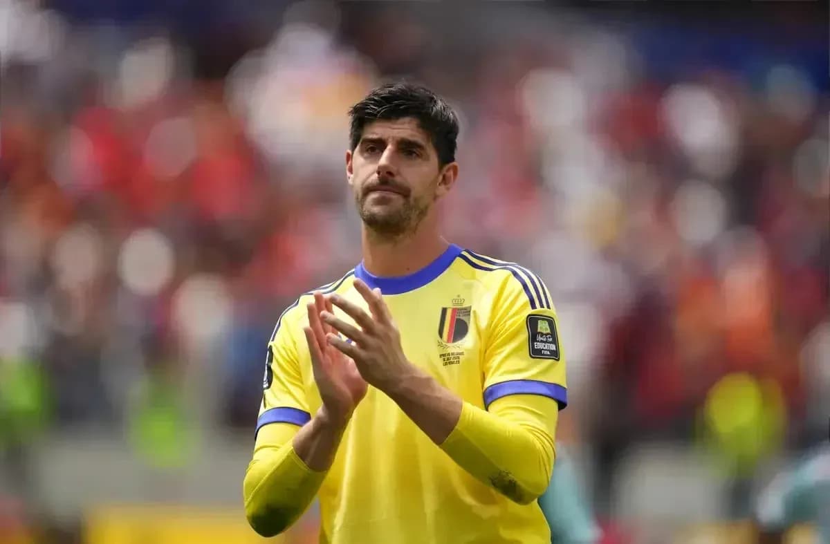 Goalkeeper in yellow jersey applauding fans