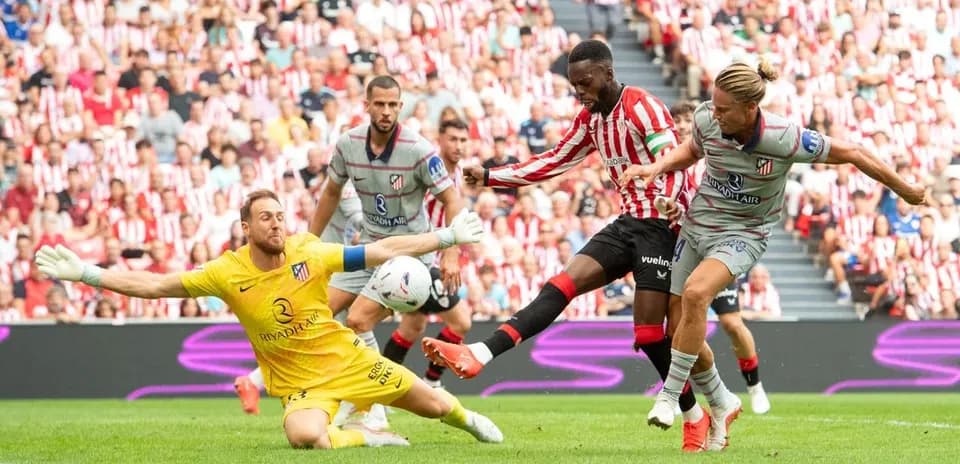 Athletic Club player attempts to score against Atletico Madrid
