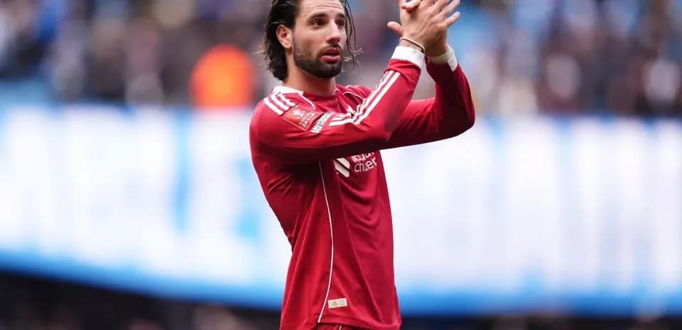 Player applauding fans during a match