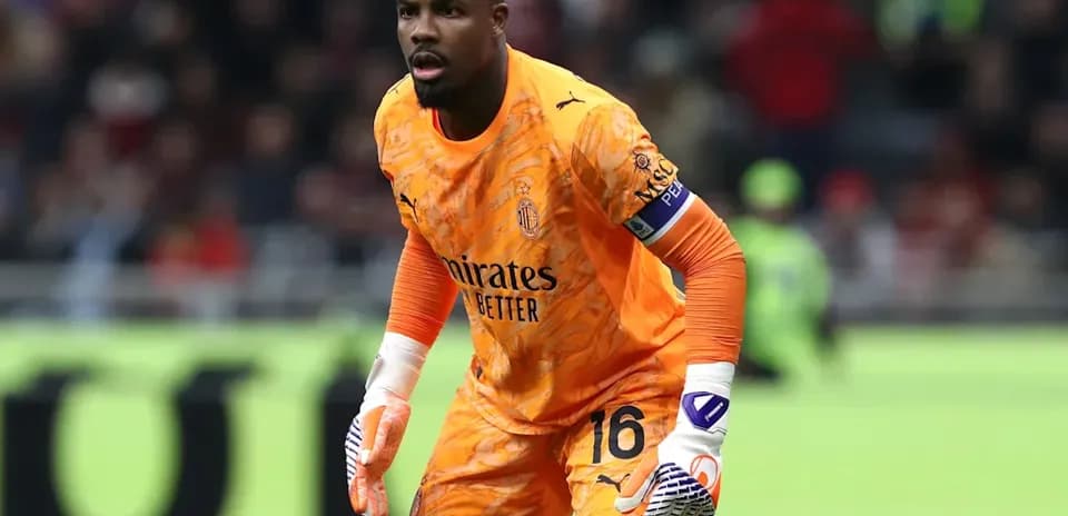 Goalkeeper in orange kit preparing for play