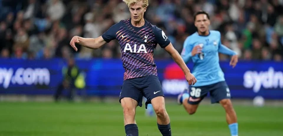 Tottenham player dribbling the ball during match