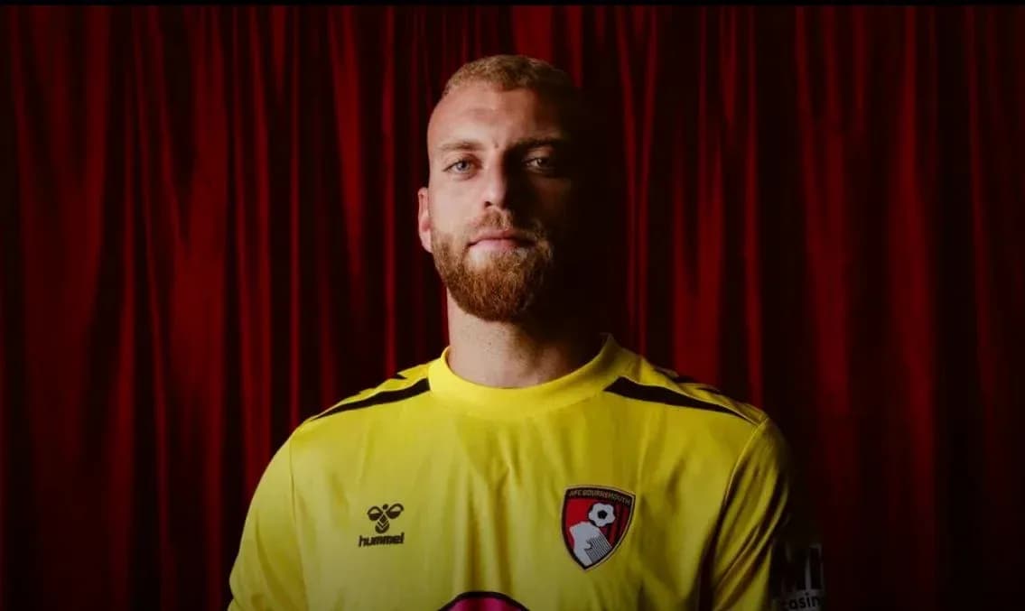 Goalkeeper wearing yellow jersey with AFC Bournemouth logo