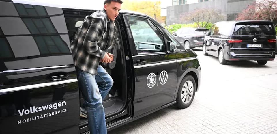 Player exiting a Volkswagen vehicle at venue