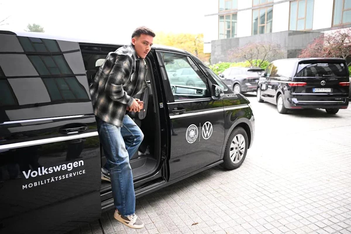 Player exiting a Volkswagen vehicle at venue