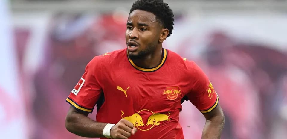 Player running in red RB Leipzig jersey during match