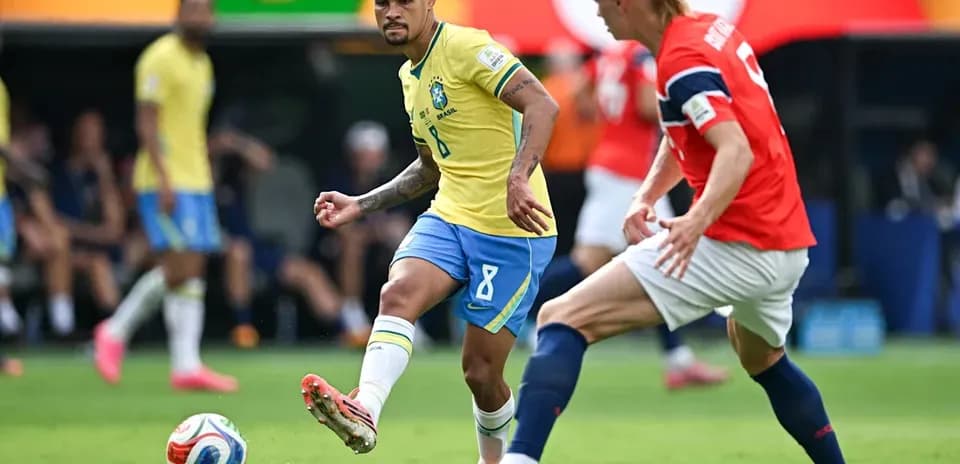 Brazilian player passing the ball during match