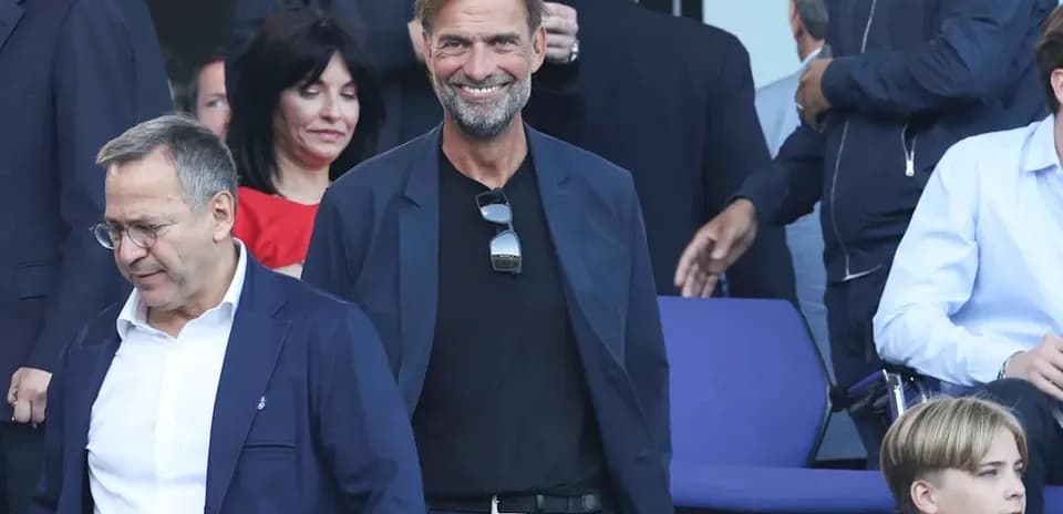 Two men smiling in stands before an event