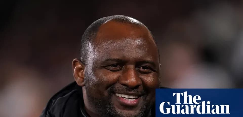 Coach smiling during match at stadium