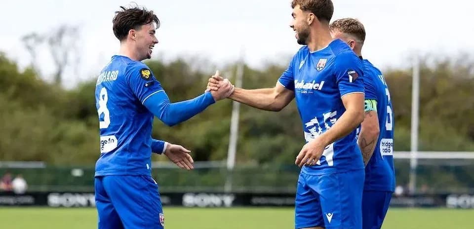 Two players shaking hands during training session