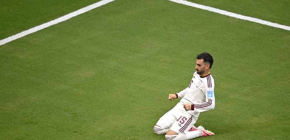 Player celebrating after scoring a goal on field