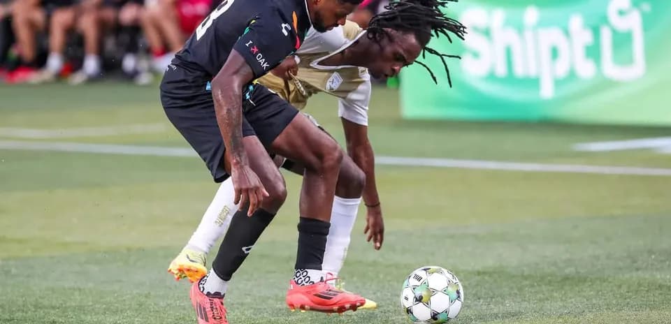 Players contesting for the ball in match