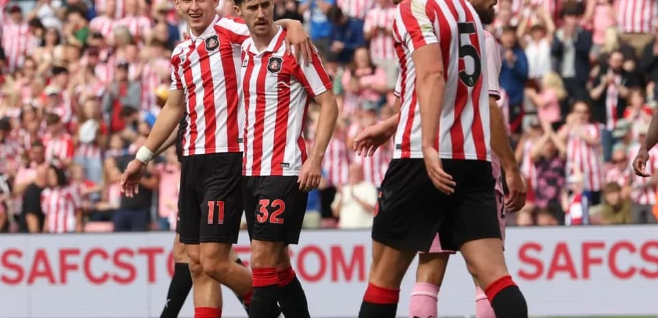 Sunderland players celebrating a goal on the field