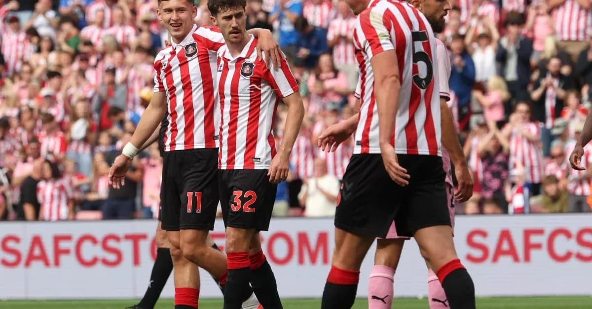 Sunderland players celebrating a goal on the field