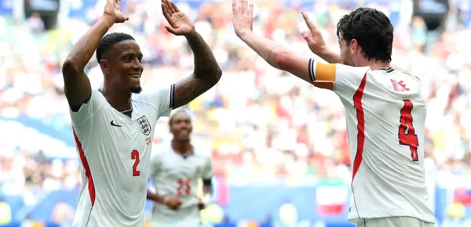 Two England players celebrating during a match