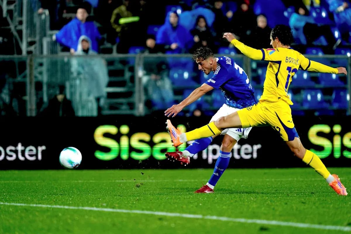 Player attempting to shoot during Hellas Verona match