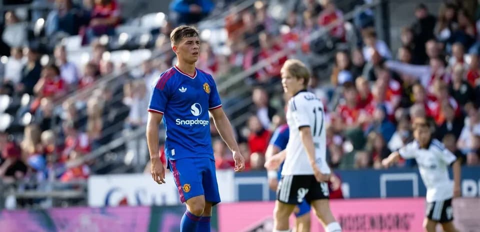 Manchester United player in blue jersey during match