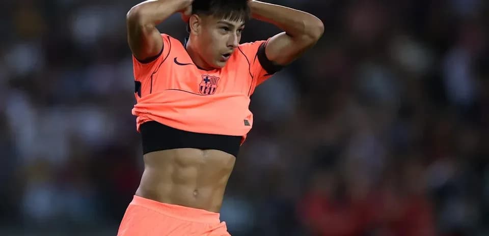 Player adjusting jersey during match action