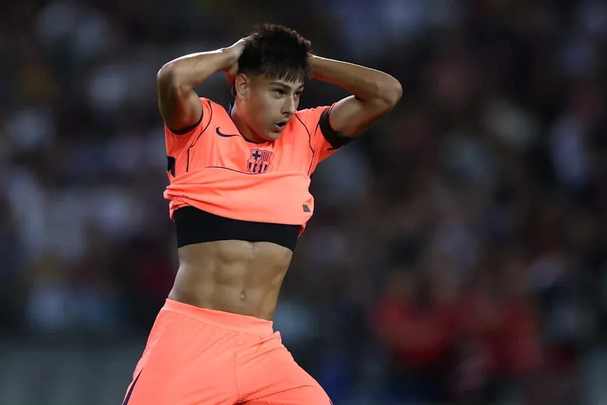 Player adjusting jersey during match action