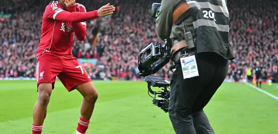 Liverpool player celebrating with camera crew