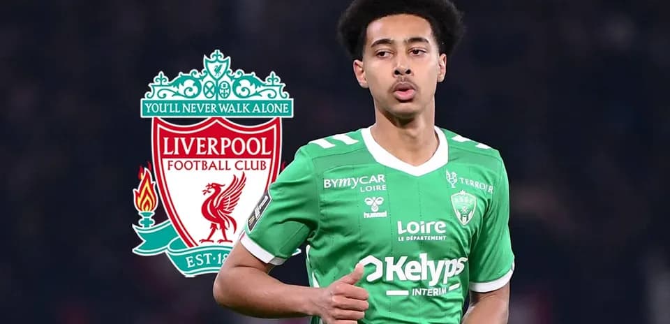 Player in green kit during match with Liverpool logo