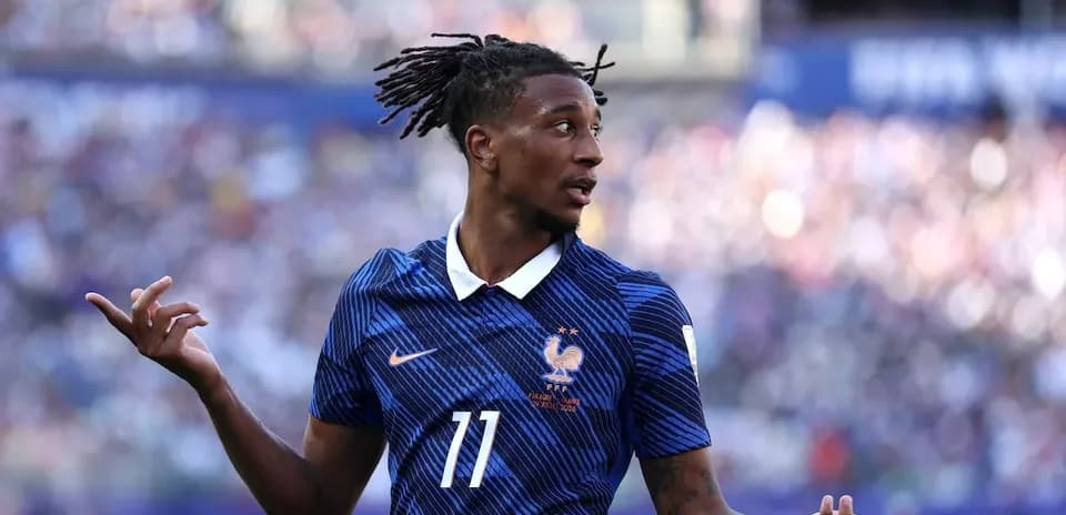 Player in France jersey gesturing during match