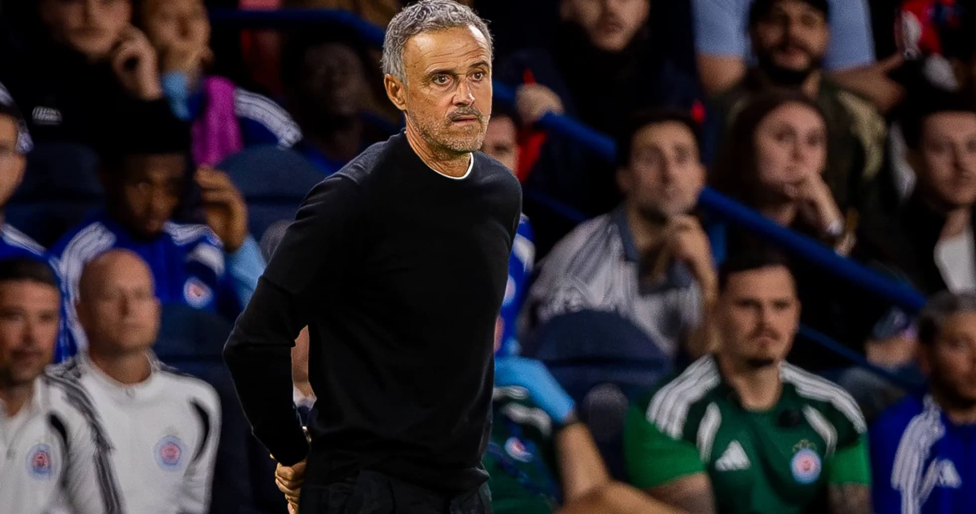 Coach standing on the sidelines during a match