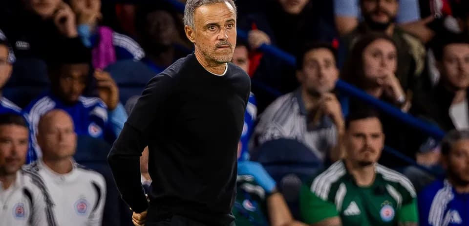 Coach standing on the sidelines during a match