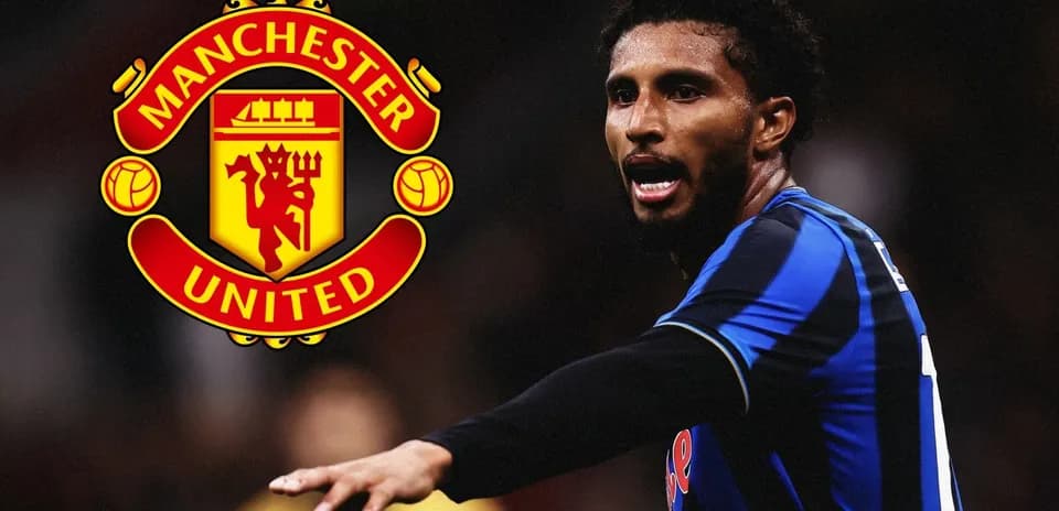 Player gesturing during match with Manchester United logo