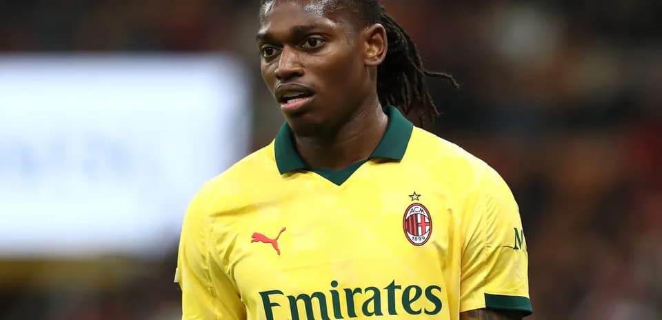 AC Milan player in yellow kit during match