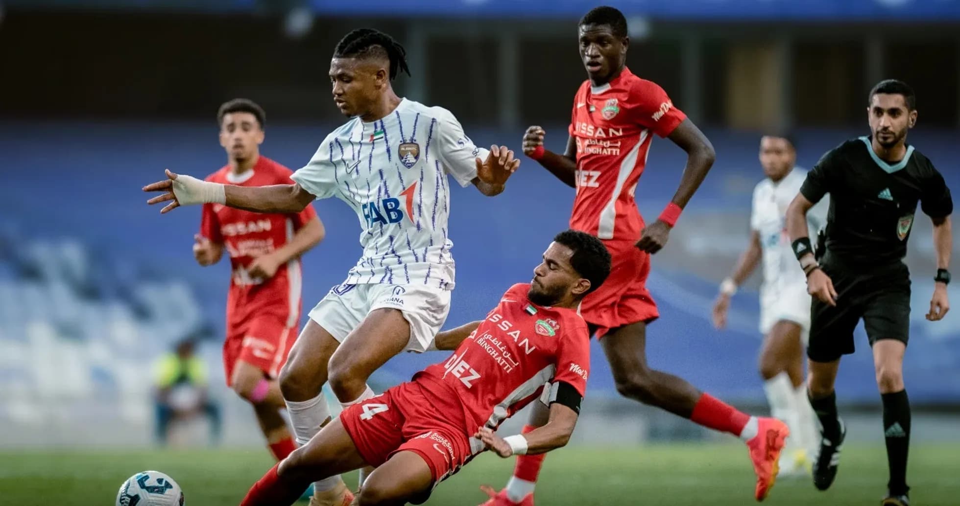 Al Ain U23 player dribbling past Al Sharjah U23 opponent